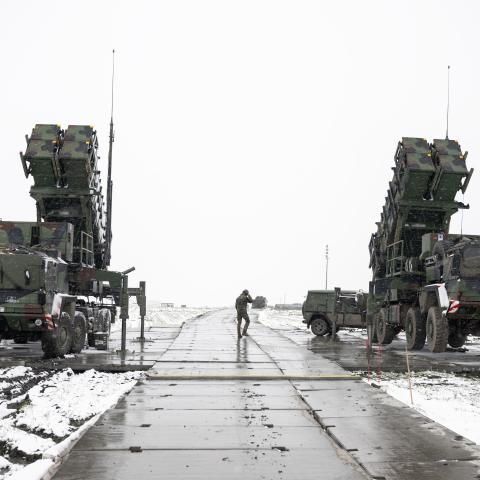 Trailers with launchers for guided missiles of a German Patriot air defense system stand on a snow-covered field in southeastern Poland on April 3, 2023. (Getty Images)