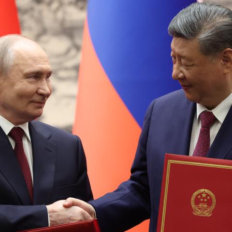Russian President Vladimir Putin and Chinese President Xi Jinping shake hands during a signing ceremony at the Great Hall of the People on May 20, 2026, in Beijing, China. (Getty Images)