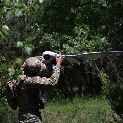 serviceman of the State Border Guard Service of Ukraine prepares an UAV for a patrol flight along the Ukraine-Belarus border in Chernigiv region on June 1, 2026. (Getty Images)