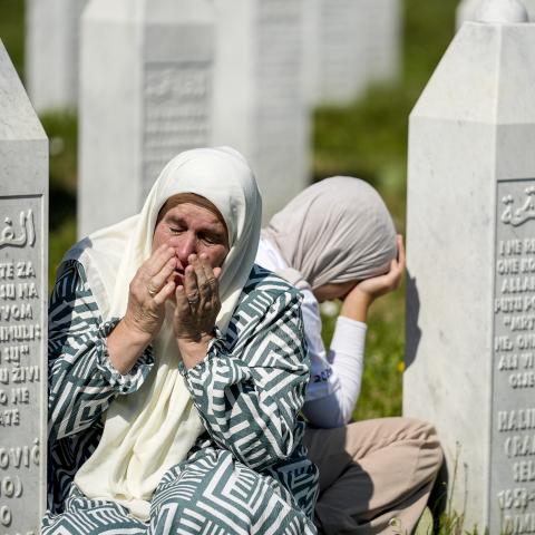Relatives of victims of the 1995 Srebrenica genocide pray at the graves of their loved ones at the Potocari Memorial Cemetery in Potocari, Bosnia and Herzegovina, on July 11, 2026. (Getty Images)