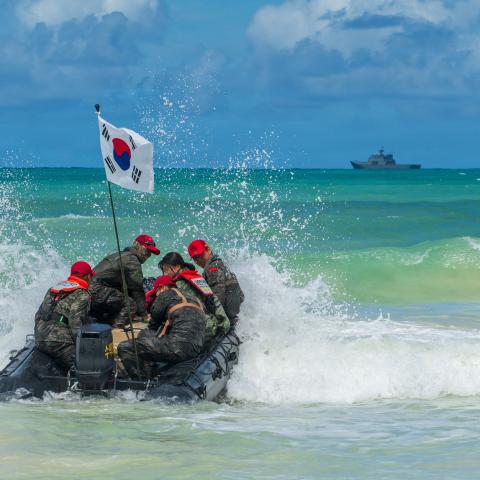 Republic of Korea marines depart shore in a combat rubber raiding craft after ship-to-shore movements as part of Exercise Rim of the Pacific 2026 at Marine Corps Training Area Bellows, Hawaii, July 20, 2026. Thirty nations, 30 ships, five submarines, 15 national land forces, more than 190 aircraft and more than 30,000 personnel are participating in RIMPAC in and around the Hawaiian Islands, June 24 to July 31. The world's largest international maritime exercise, RIMPAC provides a unique training opportunity