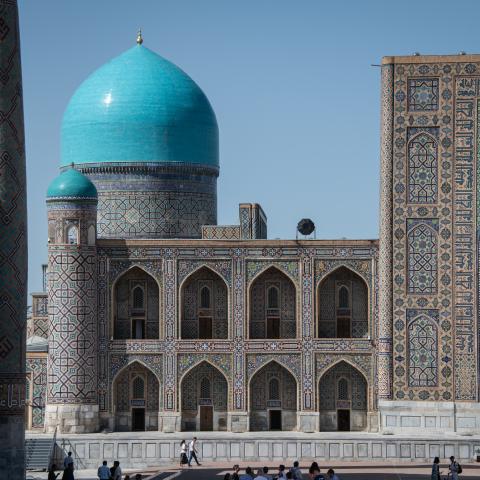 On April 10, 2025, international tourists and Uzbek locals visit historic attractions in Samarkand, Uzbekistan, an ancient Silk Road city with many mosques, madrasas, and mausoleums. Above, visitors explore Registan Square. (Photo by Diego Cupolo/NurPhoto via Getty Images)