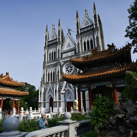 A woman prays at the Xishiku Church in Beijing on April 26, 2025. (Getty Images)
