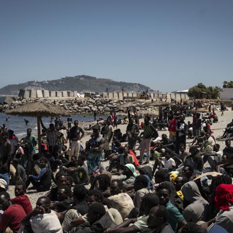Migrants wait on the beach on August 2, 2026 in Ceuta, Spain. (Getty Images)