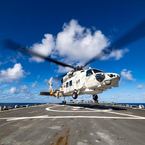 A Japan Maritime Self-Defense Force SH-60K helicopter takes off from the flight deck of the Arleigh Burke-class guided-missile destroyer USS Higgins on June 11, 2024. (US Navy)
