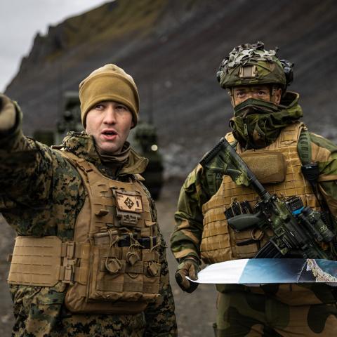 U.S. Marine Corps 1st Lt. Joel Murcek, a fire support coordinator with Fire Support Battalion, 10th Marine Regiment, coordinates displacement tactics with Norwegian Home Guard soldiers with 3rd Platoon, District 11, in Jan Mayen, Norway, Sept. 1, 2026. This bilateral planning, conducted during Operation Atlantic City 26, is crucial for integrating movement and security procedures, ensuring U.S. and Norwegian forces can operate seamlessly in the High North. Atlantic City 26 is a Norwegian-led trilateral read