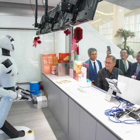 Diplomatic envoys of ASEAN countries to China watch an intelligent robot during a visit to the China-ASEAN AI Application Center on July 22, 2026, in Nanning, China. (Getty Images)