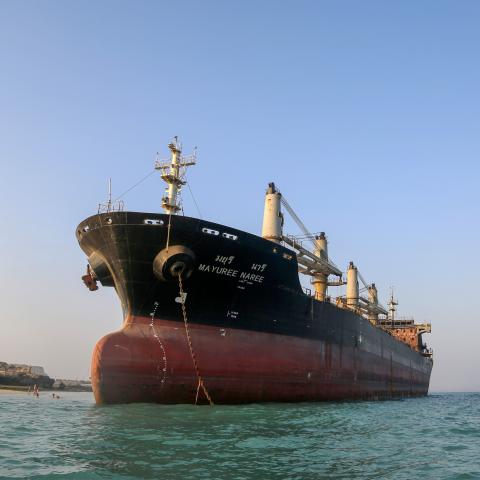 A bulk carrier that was struck by a missile near the Strait of Hormuz during attacks launched by the United States and Israel against Iran is seen stranded off the coast of Qeshm Island, Iran, on September 11, 2026. (Getty Images)