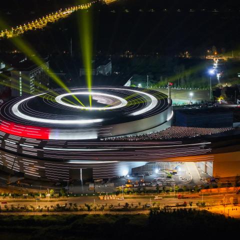 The Burning Plasma Experimental Superconducting Tokamak (BEST) facility, which will house a compact fusion experiment device, undergoes its first exterior lighting test on September 9, 2026, in Hefei, China. (Getty Images)