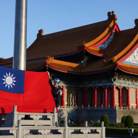 Guards raise Taiwan’s national flag at the Chiang Kai-shek Memorial Hall in Taipei on October 15, 2024. (Getty Images)