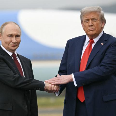 US President Donald Trump greets Russian President Vladimir Putin on the tarmac after they arrived at Joint Base Elmendorf-Richardson in Anchorage, Alaska, on August 15, 2025. (Getty Images)
