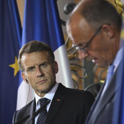 France’s President Emmanuel Macron looks on as German Chancellor Friedrich Merz speaks during a joint press conference at Augustusburg Castle during the 26th German-French cabinet in Bruehl, Germany, on July 17, 2026. (Getty Images)
