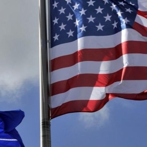 A picture taken on March 2, 2014 shows the US and NATO flags in the wind at the NATO headquarters in Brussels.  (GEORGES GOBET/AFP/Getty Images)