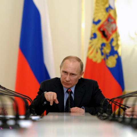 Russia's President Vladimir Putin (C) chairs a government meeting in his Novo-Ogaryovo residence, outside Moscow on March 5, 2014 (ALEXEY DRUZHININ/AFP/Getty Images)