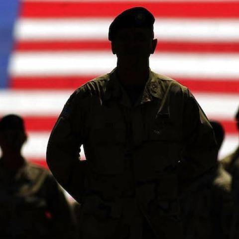 Colonel Don Campbell with members of the U.S. Army Fourth Infantry Division stand prior to the home opener between the Anaheim Angels and the Texas Rangers, April 9, 2004 in Arlington, Texas. (Ronald Martinez/Getty Images)