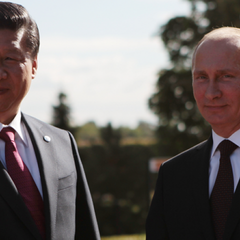 Russian President Vladimir Putin and President of the People's Republic of China Xi Jinping shake hands at the meeting of the BRICS delegation heads, in St. Petersburg, Russia, September 5, 2013. (Igor Russak/Host Photo Agency via Getty Images)