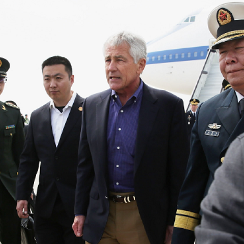 Escorted by Chinese military personnel, U.S. Secretary of Defense Chuck Hagel arrives at Qingdao International Airport April 7, 2014 in Qingdao, China. (Alex Wong/Getty Images)