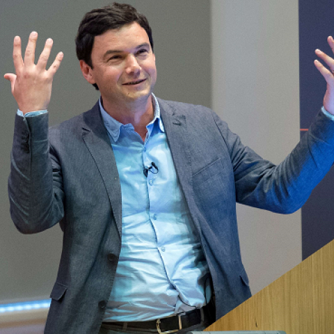 French economist Thomas Piketty speaks to students and guests during a presentation at King's College, central London, on April 30, 2014. (LEON NEAL/AFP/Getty Images)