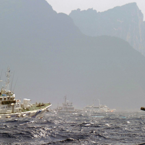A Taiwan fishing boat (R) is blocked by a Japan Coast Guard (L) vessel near the disputed Diaoyu / Senkaku islands in the East China Sea on September 25, 2012. (SAM YEH/AFP/GettyImages)