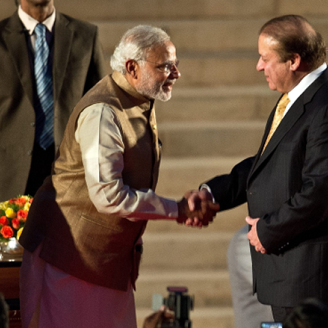 Indian Prime Minister Narendra Modi (5th L) shakes hands with Pakistani Prime Minister Nawaz Sharif (3rd R) as Sri Lankan President Mahinda Rajapakse (R) looks on after the swearing-in ceremony at the Presidential Palace in New Delhi on May 26, 2014.(PRAK