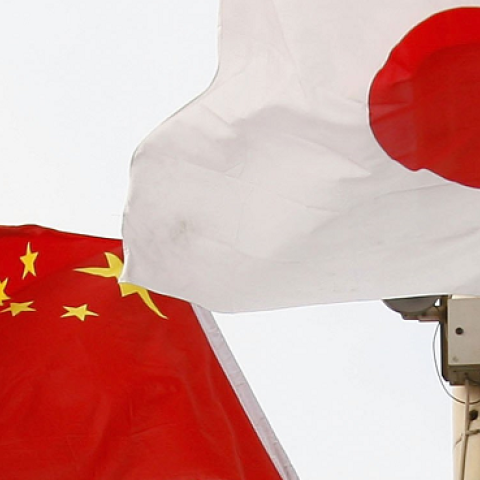 Chinese and Japanese national flags fly in Tiananmen Square before a welcoming ceremony for Japan's new Prime Minister Shinzo Abe October 8, 2006 in Beijing, China. (China Photos/Getty Images)