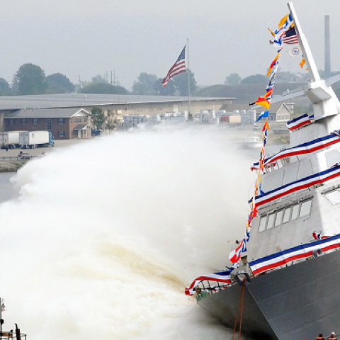 The nation’s first Littoral Combat Ship, Freedom, makes a side launch during her christening at the Marine shipyard in Marinette, Wis., Sept. 23, 2006. (Lockheed Martin)