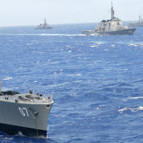 Naval ships from multiple nations steam in formation during the RIMPAC excercise operations near Oahu, Hawaii, July 11, 2002. (Phil Mislinski/Getty Images)