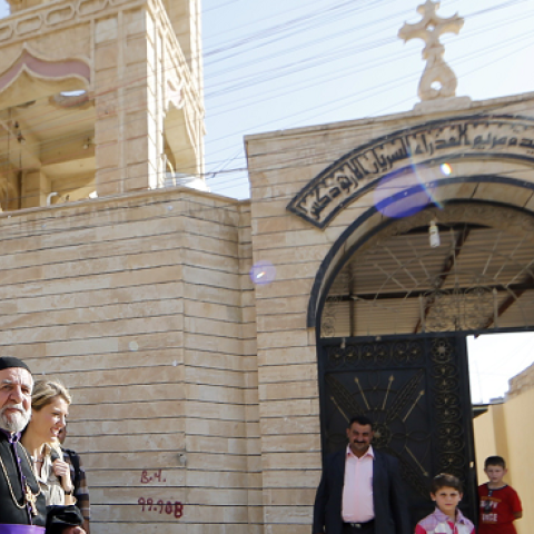 An Iraqi security officer stands guard outside the Church of the Virgin Mary in Bartala, June 15, 2012. (KARIM SAHIB/AFP/Getty Images)