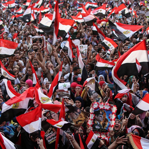 Egyptians wave national flags in Cairo's Tahrir Square on June 3, 2014 after ex-army chief Abdel Fattah al-Sisi won Egypt's presidential election. (MOHAMED EL-SHAHED/AFP/Getty Images)
