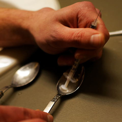 Drugs are prepared to shoot intravenously by a user addicted to heroin on February 6, 2014 in St. Johnsbury, Vermont. (Spencer Platt/Getty Images)