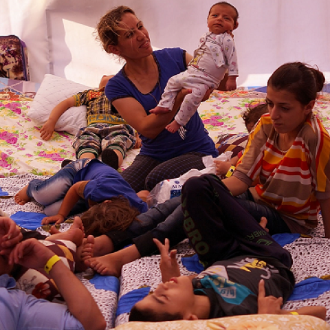 An Iraqi Christian family live in a tent at a displacement camp for Christians after having to flee their district on June 26, 2014 in Erbil, Iraq.(Spencer Platt/Getty Images)