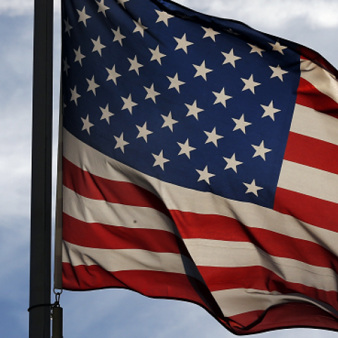 A US flag flutters at The Lafayette Escadrille Memorial of Marnes-la-Coquette, east of Paris, on November 11, 2013. (THOMAS SAMSON/AFP/Getty Images)