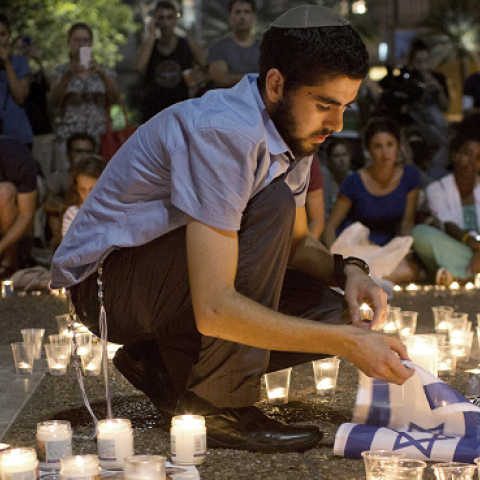 Israelis mourn and light candles in Rabin Square in Tel Aviv on June 30, 2014 after the announce that the bodies of the three missing Israeli teenagers were found. (OREN ZIV/AFP/Getty Images)