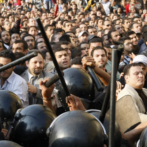 Egyptian demonstrators clash with Egyptian police in central Cairo during a protest to demand the ouster of President Hosni Mubarak and calling for reforms on January 25, 2011. (MOHAMMED ABED/AFP/GettyImages)