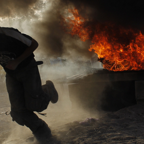 A Palestinian youth take part in military-inspired exercises organised by the Islamist movement Hamas on June 19, 2014 in Rafah, southern Gaza Strip. (SAID KHATIB/AFP/Getty Images)