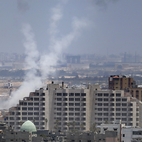 Smoke from rockets fired from Gaza City are seen after being launched toward Israel, on July 15, 2014.(THOMAS COEX/AFP/Getty Images)