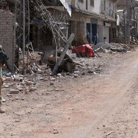Pakistani soldiers patrol through a destroyed bazaar during a military operation against Taliban militants in Miranshah, North Waziristan, July 9, 2014. (AAMIR QURESHI/AFP/Getty Images)