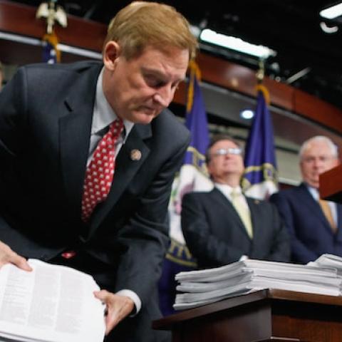 House Financial Services Committee Chairman Spencer Bachus (R-AL) (C) lifts copies of the Dodd-Frank financial reform bill, September 8, 2011 in Washington, DC. (Chip Somodevilla/Getty Images)