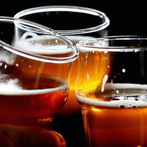 Russian River Brewing Company customers clink their glasses on February 7, 2014 in Santa Rosa, California. (Justin Sullivan/Getty Images)