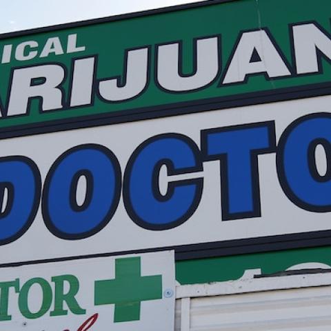 Signage hangs outside +Doctor, a medical marijuana evaluation clinic, on July 25, 2012 in Los Angeles, California. (David McNew/Getty Images)
