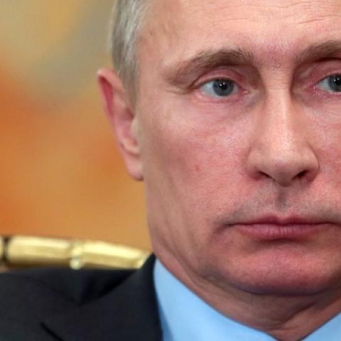 Russia's President Vladimir Putin attends a meeting in his Novo-Ogaryovo residence, outside Moscow on February 26, 2014. (MIKHAIL METZEL/AFP/Getty Images)