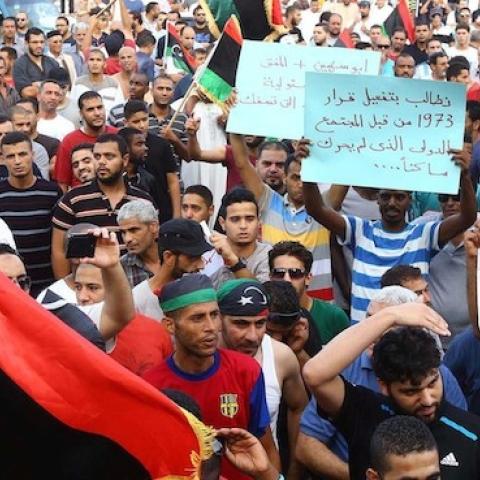 Libyans take part in a demonstration in the capital Tripoli on July 31, 2014, calling for international intervention to protect civilians. (MAHMUD TURKIA/AFP/Getty Images)
