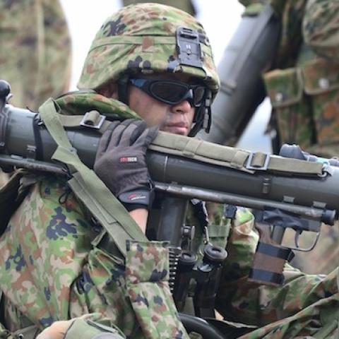 A soldier from the Japan Ground Self-Defense Force carries an 84mm Carl Gustav rocket launcher during Exercise Iron Fist 2014, a joint-exercise with US Marines and sailors at Camp Pendleton on February 9, 2014. (FREDERIC J. BROWN/AFP/Getty Images)