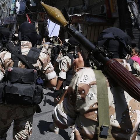 Palestinian Islamic Jihad militants parade down a street in downtown Gaza City on August 29, 2014. (ROBERTO SCHMIDT/AFP/Getty Images)