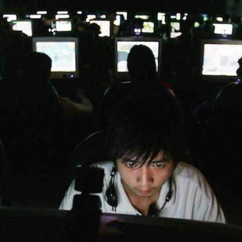 Chinese youngsters play online games overnight at an internet cafe on June 11, 2005 in Wuhan, Hubei Province of China. (Cancan Chu/Getty Images)