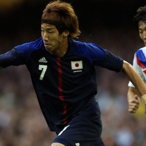 Yuki Otsu of Japan goes past Bokyung Kim of Korea during the Men's Football Bronze medal play-off of the London 2012 Olympic Games on August 10, 2012. (Julian Finney/Getty Images)