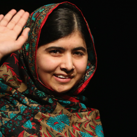 Malala Yousafzai waves to the crowd at a press conference at the Library of Birmingham after being announced as a recipient of the Nobel Peace Prize, on October 10, 2014 in Birmingham, England. (Christopher Furlong/Getty Images)