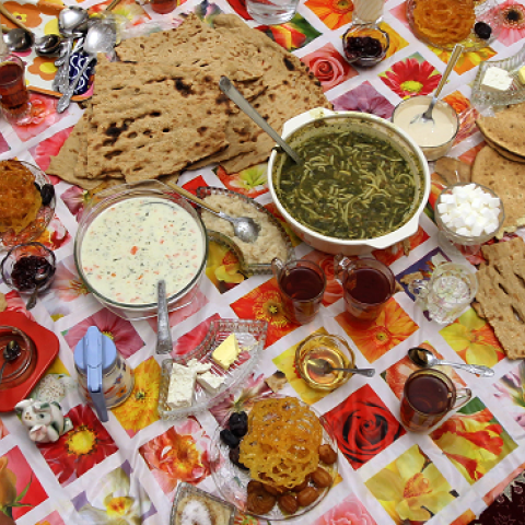Members of a family attend an iftar, the evening meal to break the daily fast observed by Muslims during the holy month of Ramadan. (ATTA KENARE/AFP/Getty Images)
