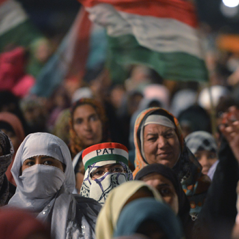 Supporters of Canadian-Pakistani cleric Tahir ul Qadri, listen to his speech during an anti-government protest in front of the Parliament in Islamabad on October 21, 2014.  ( AAMIR QURESHI/AFP/Getty Images)