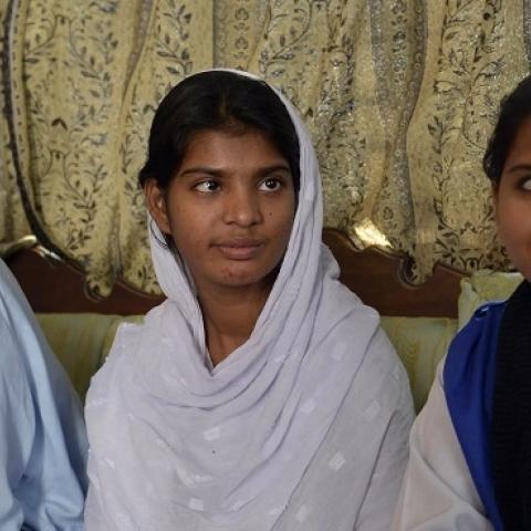 The husband and daughters of Asia Bibi, a Pakistani Christian sentenced to death for "blasphemy," at their residence in Lahore, October 13, 2014 (Arif Ali/AFP/Getty Images).